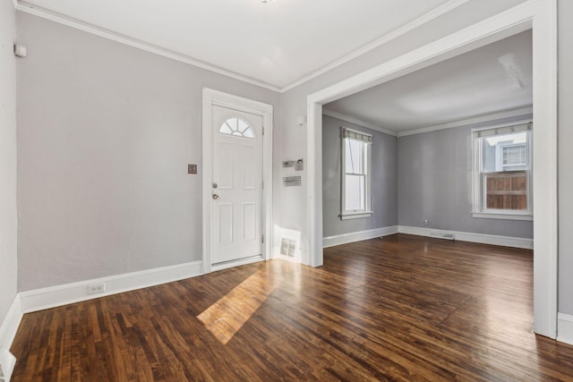 entrance foyer featuring crown molding and dark hardwood / wood-style flooring