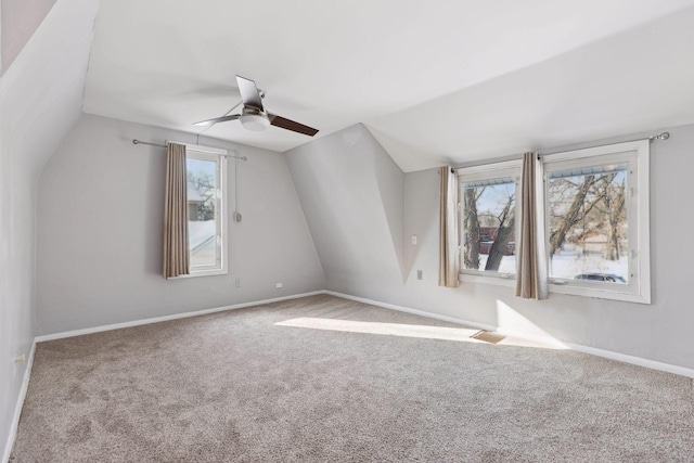 bonus room with lofted ceiling, light colored carpet, and ceiling fan