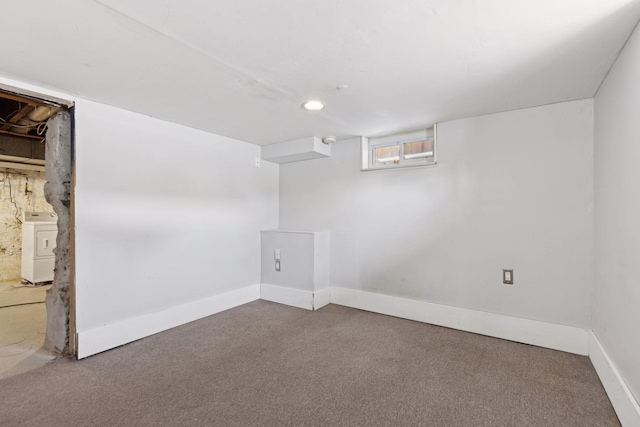 basement with washer / clothes dryer and carpet flooring