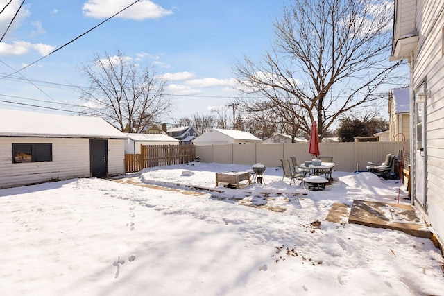 view of yard covered in snow