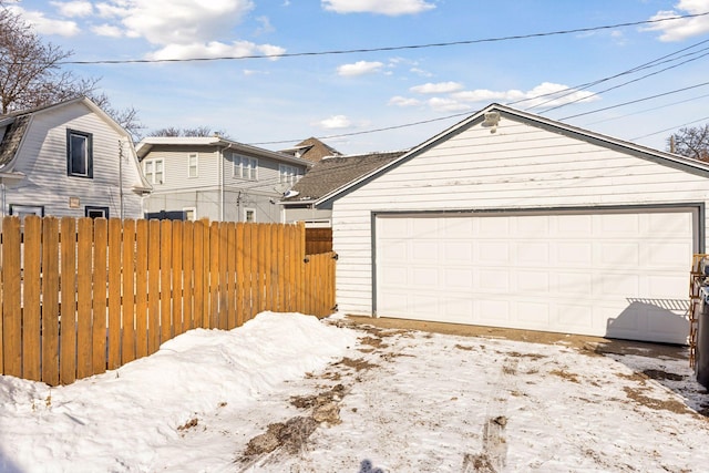 view of front of home with a garage and an outdoor structure