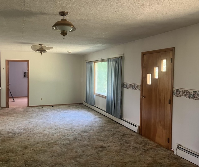 carpeted foyer entrance featuring a textured ceiling and baseboard heating