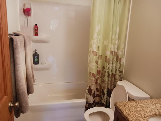 full bath featuring vanity, toilet, and shower / tub combo