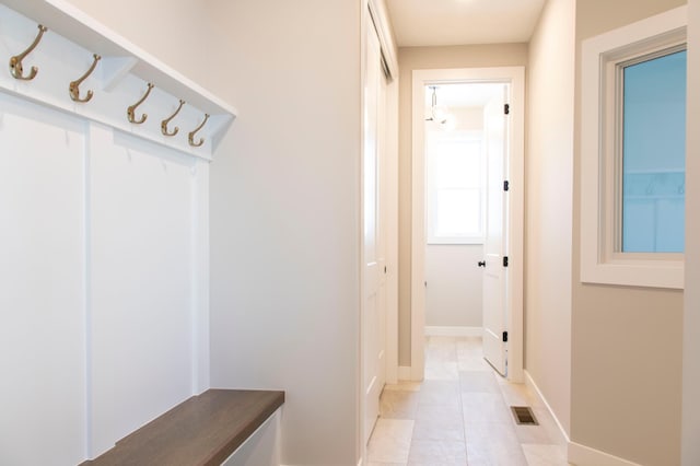 mudroom with light tile patterned floors