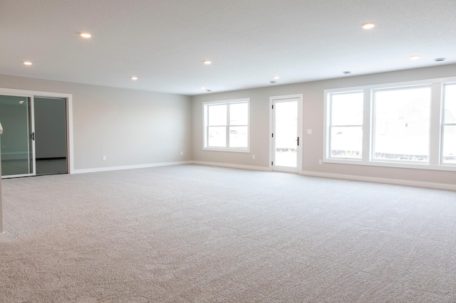 spare room with light colored carpet