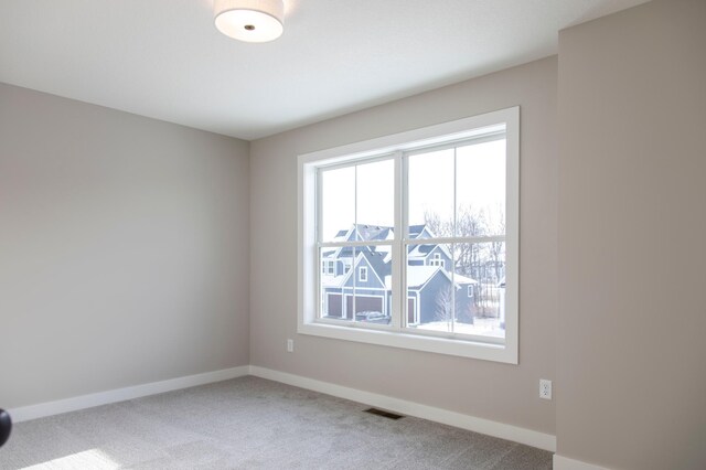 view of carpeted spare room