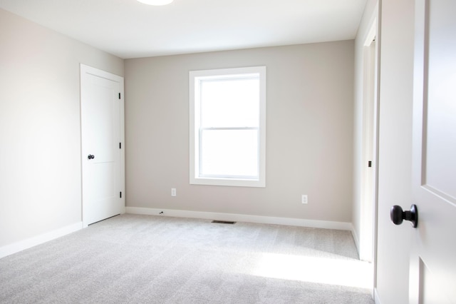 empty room with carpet flooring