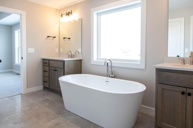 bathroom featuring vanity and a bathing tub