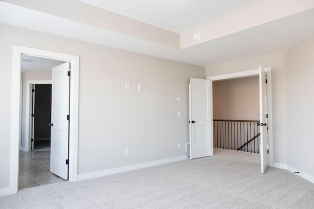 unfurnished room with light carpet