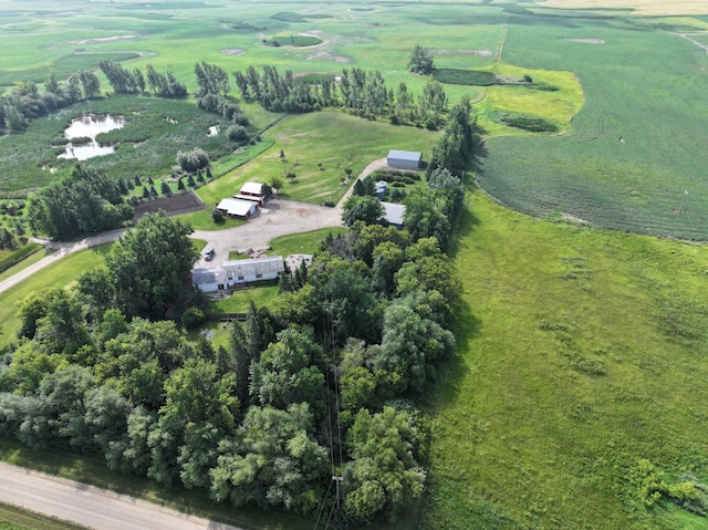 birds eye view of property with a rural view