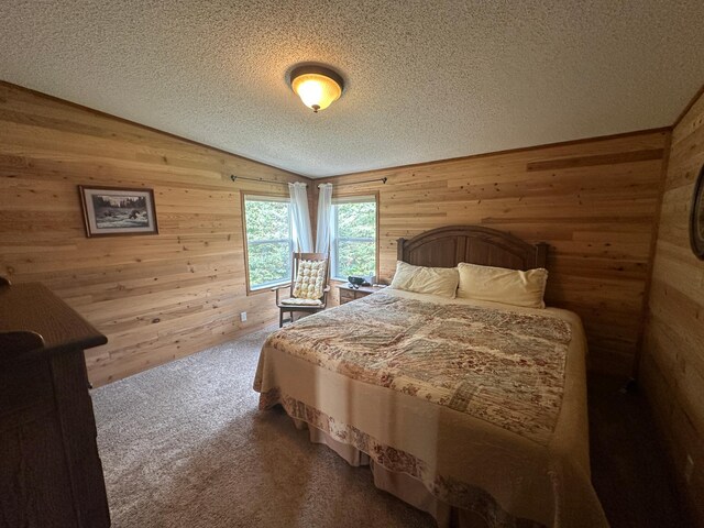 bedroom with carpet flooring, a textured ceiling, wooden walls, and lofted ceiling