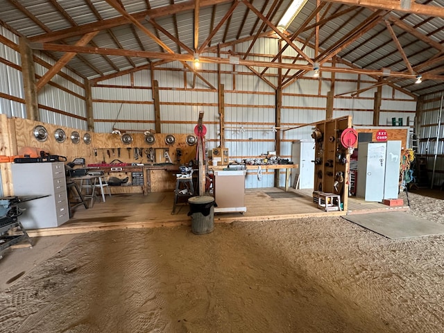 garage with metal wall and a workshop area