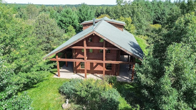 back of property with an outdoor structure