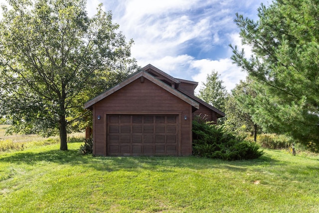 garage with a yard