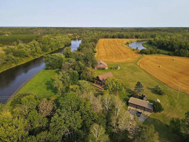 drone / aerial view featuring a water view and a rural view