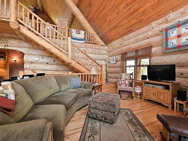 living room featuring log walls, wooden ceiling, light hardwood / wood-style floors, high vaulted ceiling, and ceiling fan