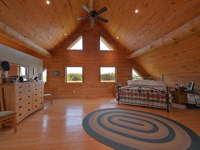 bedroom featuring wooden ceiling, light hardwood / wood-style flooring, wood walls, and vaulted ceiling with beams