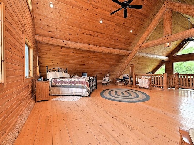 unfurnished bedroom featuring beamed ceiling, light hardwood / wood-style floors, wood ceiling, high vaulted ceiling, and wooden walls