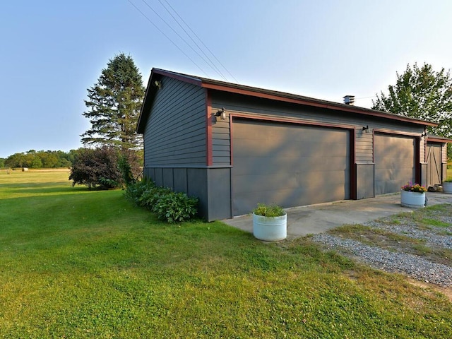 garage featuring a yard