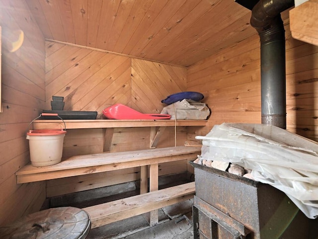 view of sauna with wood ceiling and wood walls