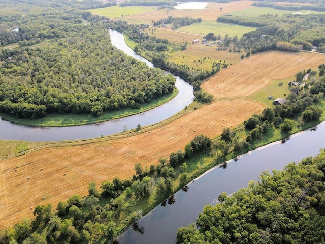 drone / aerial view with a water view and a rural view