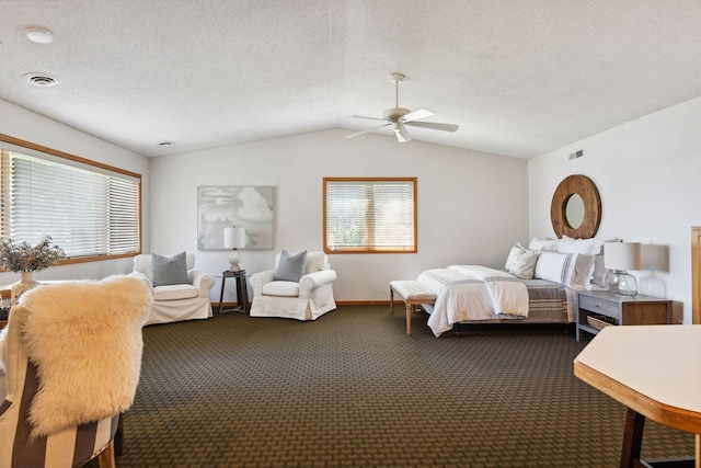 bedroom with dark colored carpet, vaulted ceiling, multiple windows, baseboards, and a ceiling fan