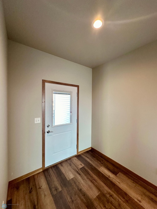 entryway with dark hardwood / wood-style flooring