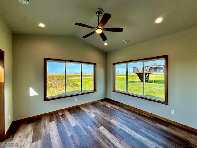 unfurnished room featuring lofted ceiling, ceiling fan, and wood-type flooring