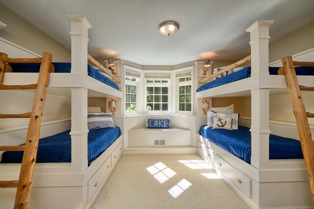 bedroom with light colored carpet