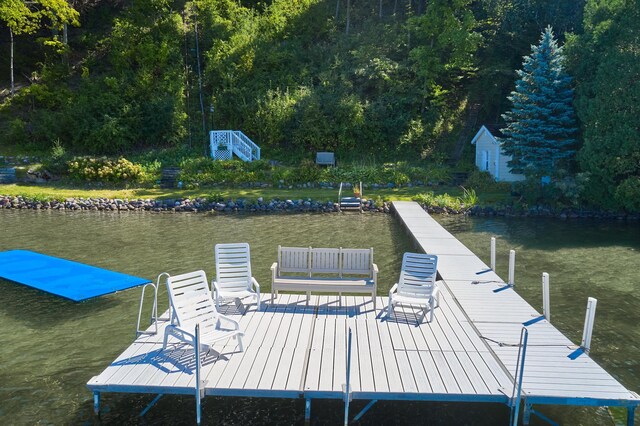 view of dock with a water view