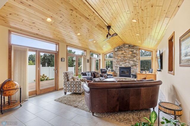 tiled living area with wooden ceiling and vaulted ceiling
