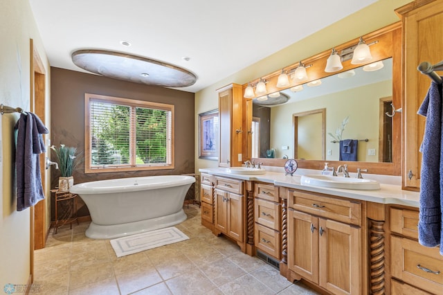 bathroom with tile patterned floors, a soaking tub, a sink, and double vanity