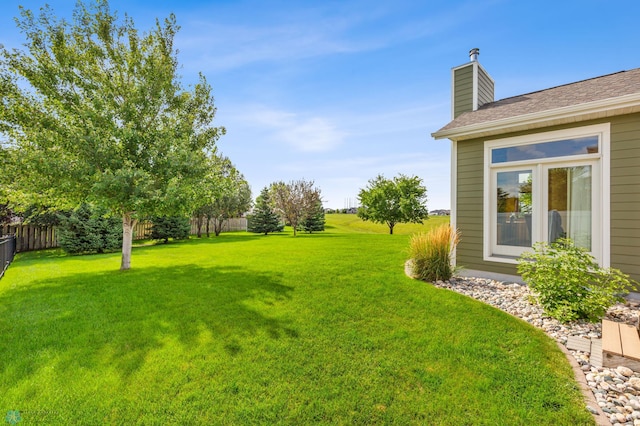 view of yard with fence