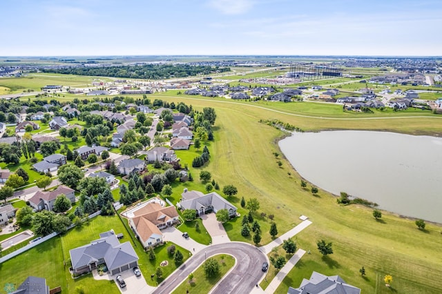 drone / aerial view featuring a water view and a residential view