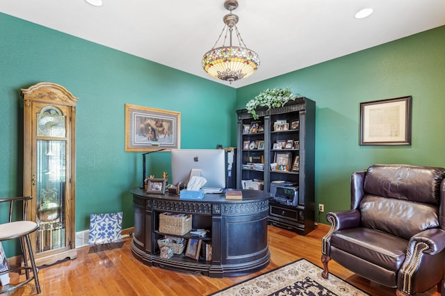 office with baseboards and wood finished floors