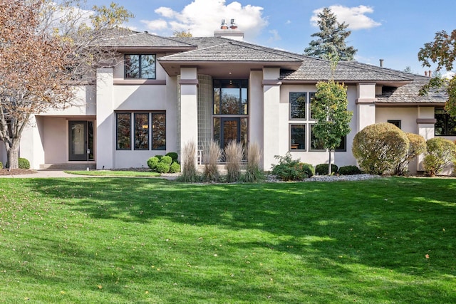 prairie-style house with a front yard