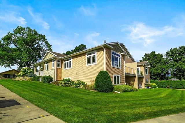 view of home's exterior with a lawn