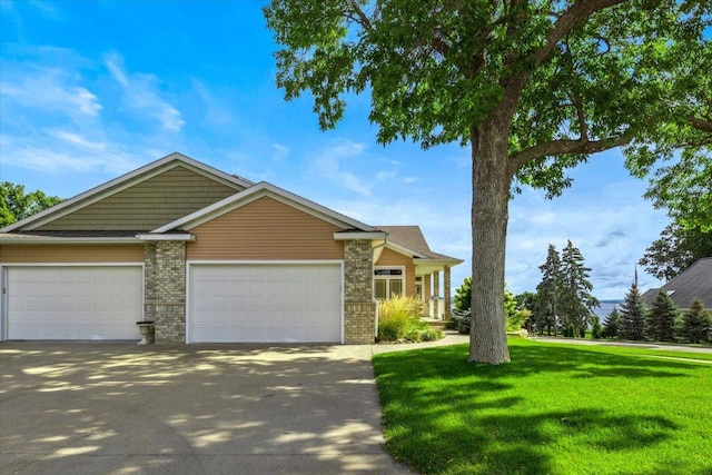 view of front facade with a garage and a front lawn