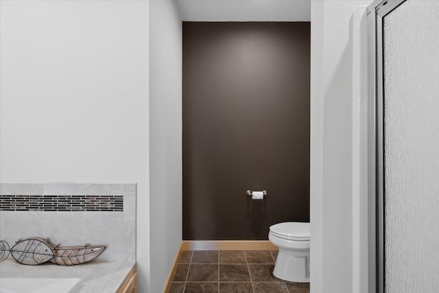 bathroom featuring tile patterned flooring, vanity, and toilet