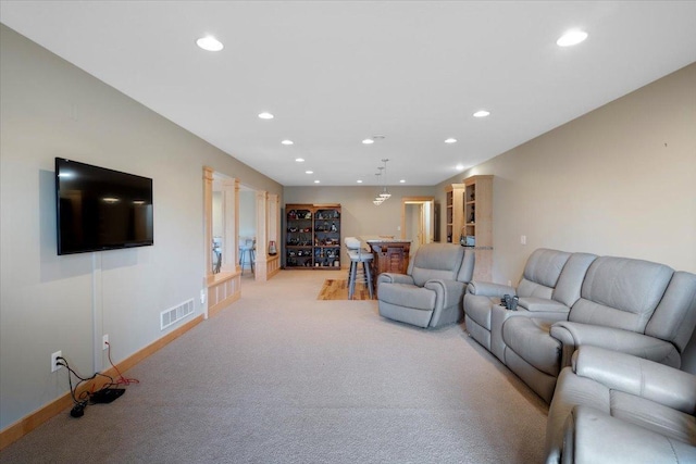 living room featuring light carpet