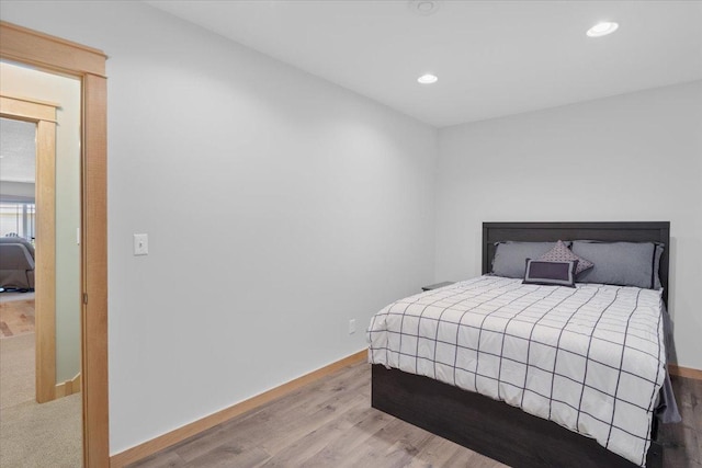 bedroom with light hardwood / wood-style floors