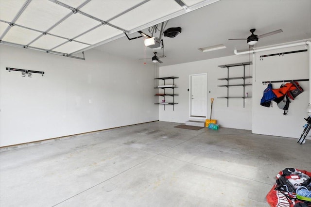 garage featuring ceiling fan and a garage door opener