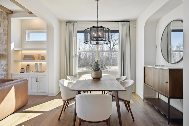 dining space featuring a chandelier and dark hardwood / wood-style floors