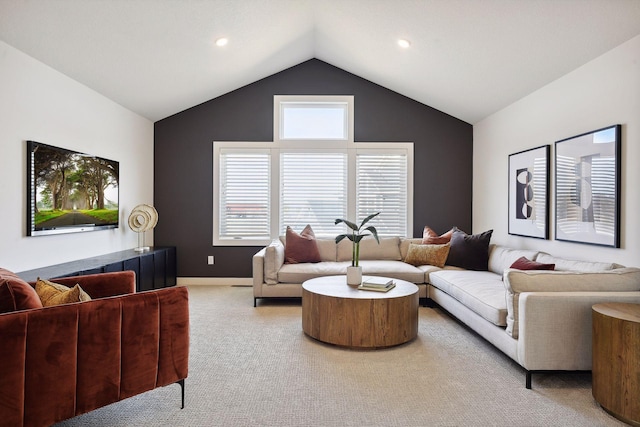 living room with lofted ceiling and carpet floors