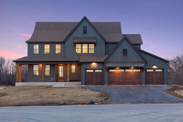 modern inspired farmhouse with driveway, a porch, board and batten siding, and a shingled roof