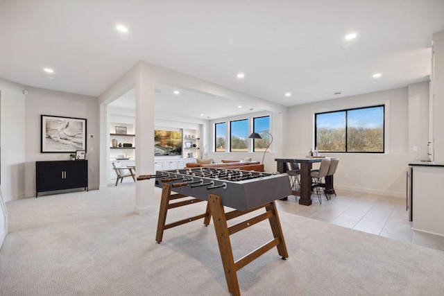 game room with a wealth of natural light, light colored carpet, and recessed lighting