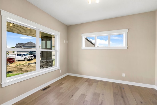 unfurnished room featuring light hardwood / wood-style flooring