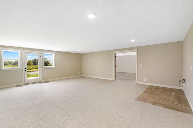 empty room featuring a textured ceiling