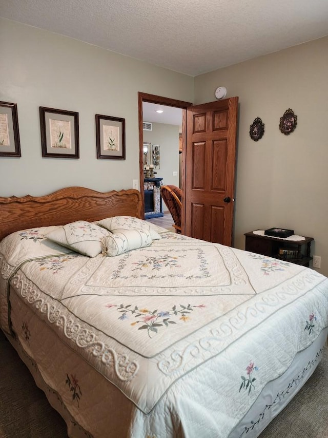 bedroom featuring a textured ceiling