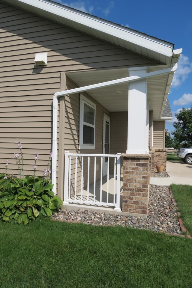 view of side of property with covered porch